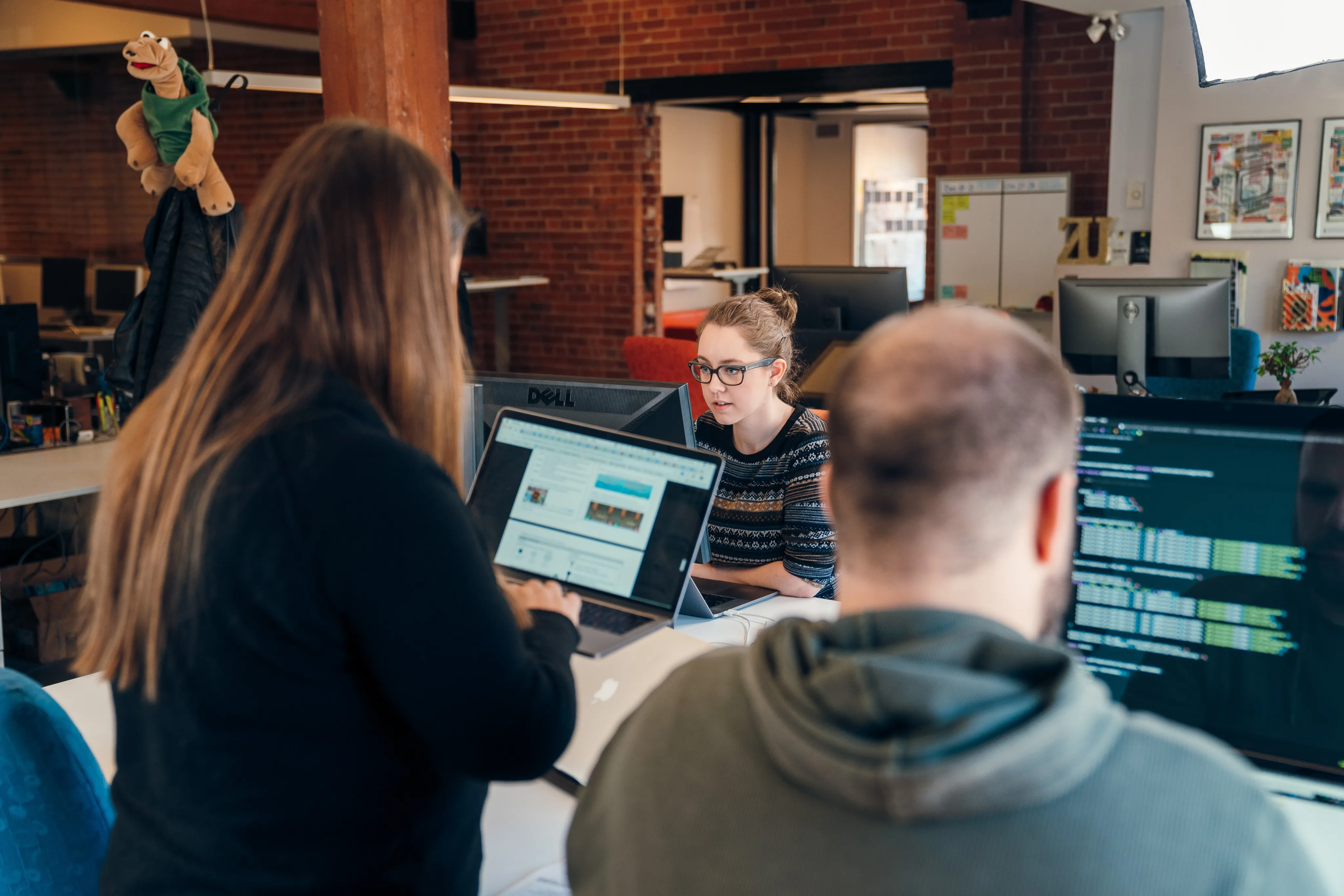 Black and white photo of the zu staff working together.