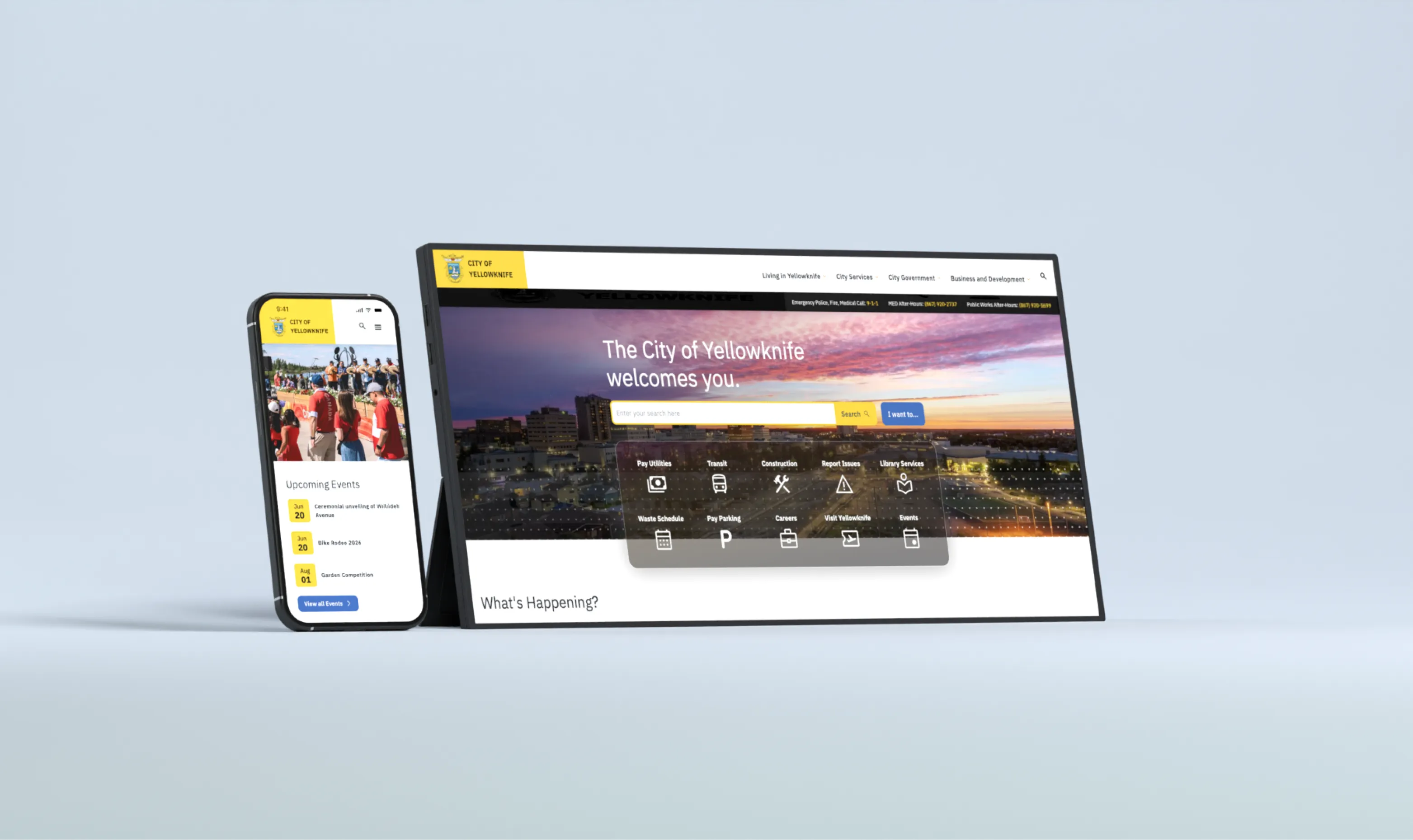 Smartphone and monitor mockup displaying the City of Yellowknife website homepage on a blue background