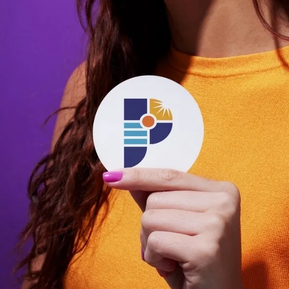 Person holding circular white paper with Pisim Power logo