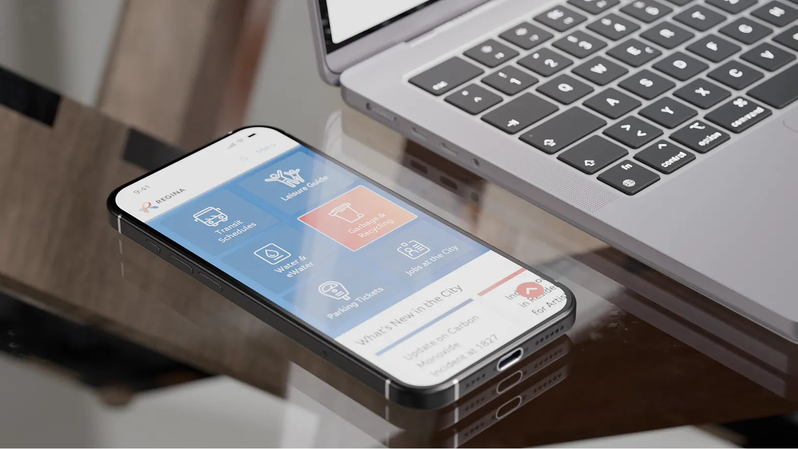 Smartphone and laptop mockup showing the City of Regina mobile interface